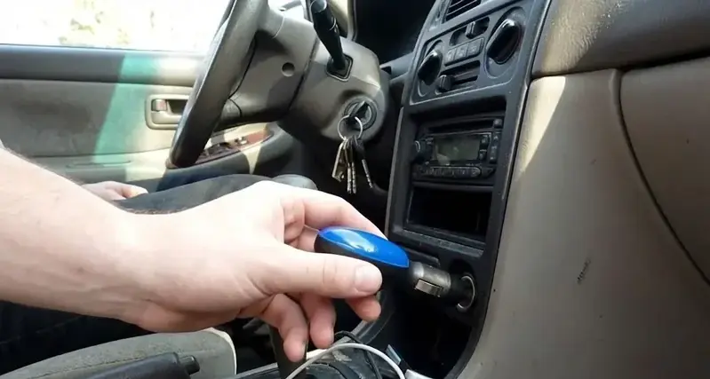 A close-up view of the FuelSync device being installed by an expert.